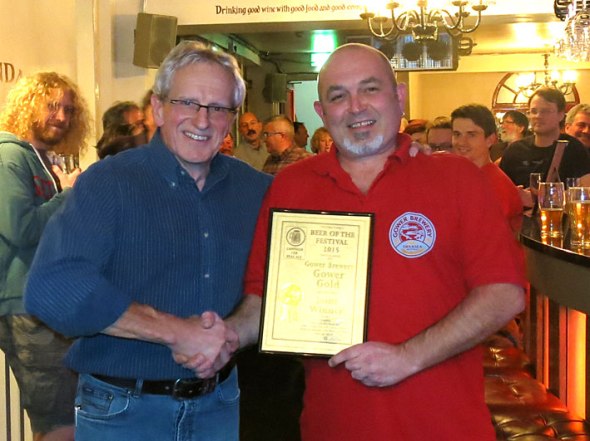 Dave Campbell of Gower Brewery being presented with the award by Chris Radford.