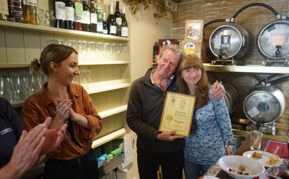 road-and-karen-receiving-the-award