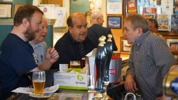 Camra members Donough Shanahan, Paul James and Stewart Pinching at the bar with landlord Gary Owen.