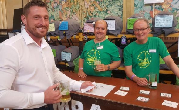 Serving beers at last year's festival.