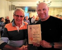 Chris Radford, beer festival chairman, presents the award to Ray Davies of Grey Trees Brewery.