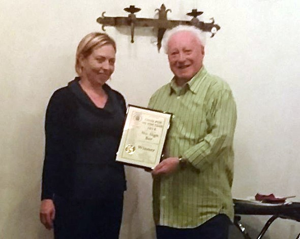 Becky Oliver of the No Sign receives her Cider Pub of the Year award award from Swansea Camra chairman Paul James.