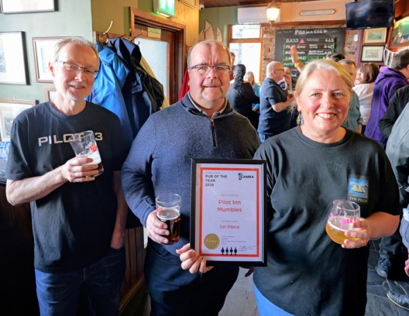 Swansea Camra chairman Stewart Pinching presents the 2026 Pub of the Year Award to Richard and Jo Bennett of The Pilot.